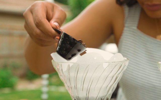 beans being poured into the filter.
